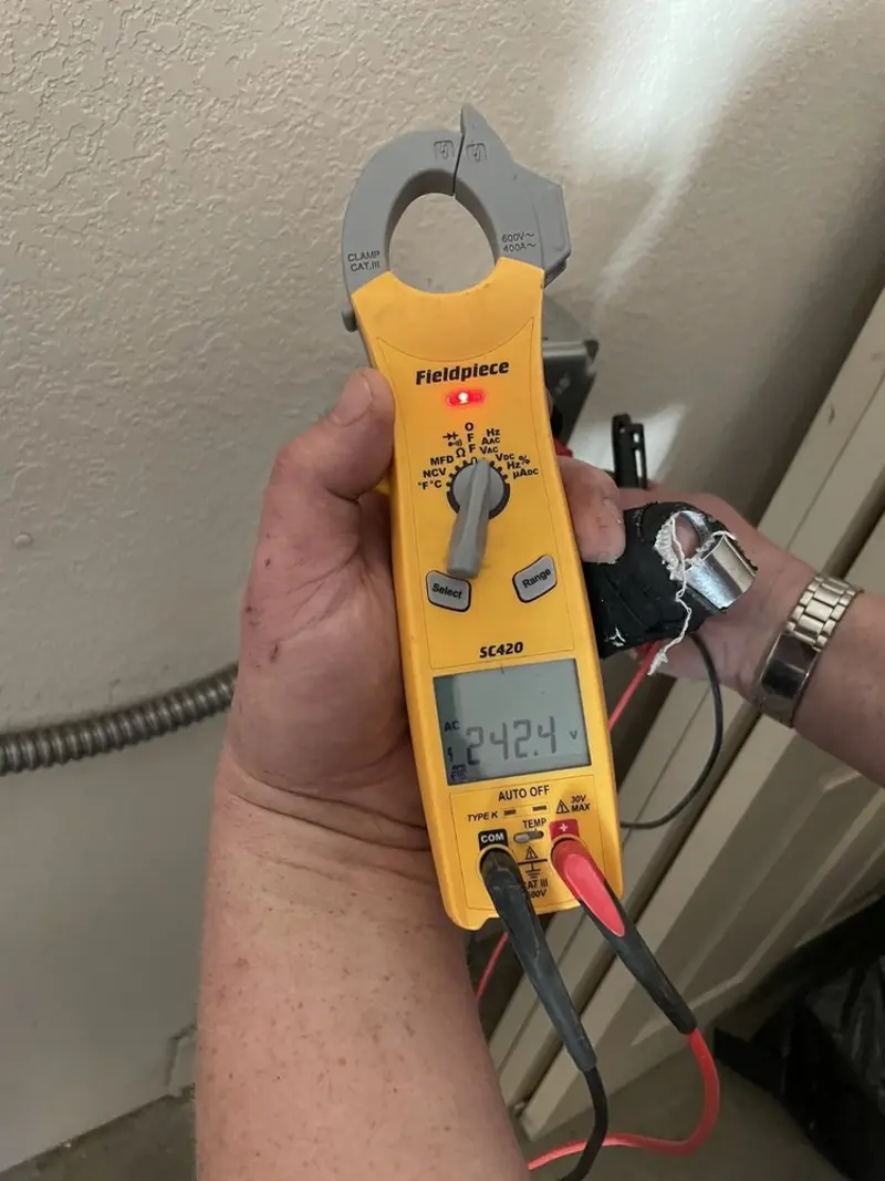 Voltage testing with clamp meter during Generator Installation in Verona Walk